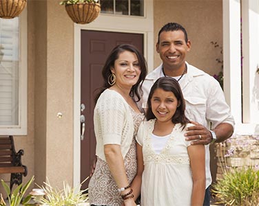 A happy family moving into their new home.